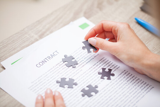 Business concept, woman close up makes up puzzle
