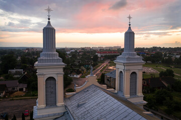 Fototapeta premium Beautiful church in the style of late classicism in the city center at sunset in summer. aerial photography