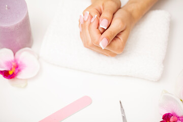 Obraz na płótnie Canvas Nail care, woman demonstrates a fresh manicure done in a beauty studio