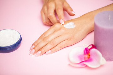 Obraz na płótnie Canvas Hand skin care, woman applies moisturizer on soft silky skin