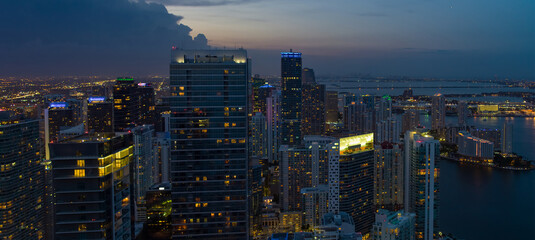 Aerial photo highrise towers Brickell Miami business district at night