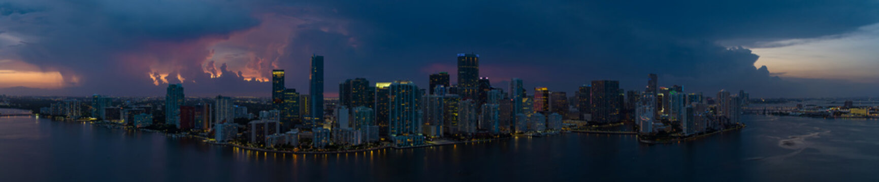 Amazing aerial drone panorama Brickell Miami with sunset storm clouds after twilight