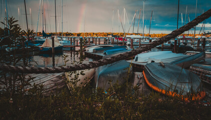 Fototapeta premium Sunrise with rainbow on the lake