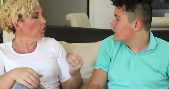 Angry mother and her teenage son yelling at each other