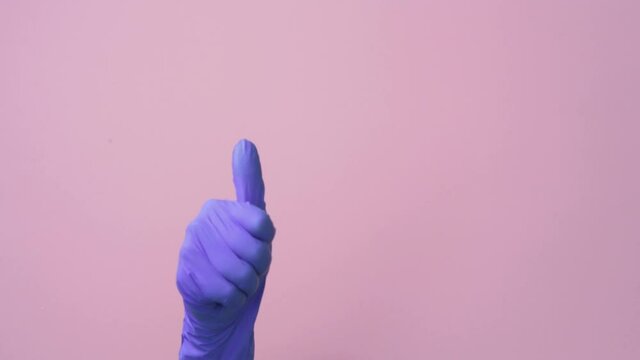 Thumb up close-up in surgical, gesture recommendation for a successful operation