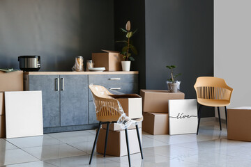 Packed belongings in new flat on moving day