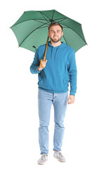 Handsome young man with umbrella on white background