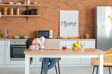 Young woman falling asleep during work at home. Concept of sleep deprivation