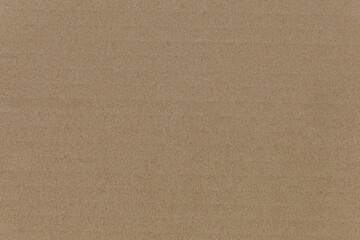 Cardboard texture top view. Brown paper background closeup. Paper texture brown sheet absrtact background. Light brown wrapping texture