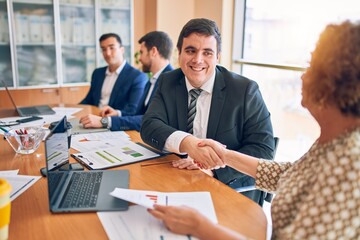 Business lawyers workers meeting at law firm office. Professional executive partners working on finance strategry at the workplace. Shaking hands for succesful agreement.