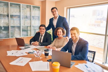 Business lawyers workers meeting at law firm office. Professional executive partners working on finance strategry at the workplace. Smiling happy and cofident to the camera.