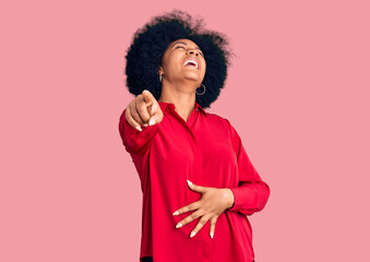 Obraz na płótnie Canvas Young african american girl wearing casual clothes laughing at you, pointing finger to the camera with hand over body, shame expression