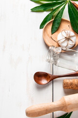 Zero waste concept. Natural biodegradable kitchen utensils on a white wooden background.