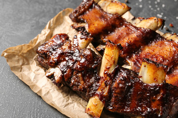 Tasty beef short ribs on dark background