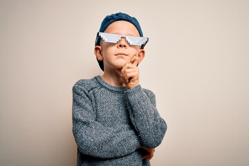 Young little caucasian kid wearing internet meme thug life glasses over isolated background with...