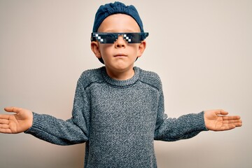 Young little caucasian kid wearing internet meme thug life glasses over isolated background...