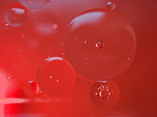 Closeup red bubbles oil with soft focus and blurred background ,macro image ,abstract background ,...