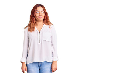 Fototapeta premium Young latin woman wearing casual clothes smiling looking to the side and staring away thinking.