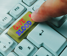 Handwriting text Give Blood. Conceptual photo an individual voluntarily has blood drawn and used...
