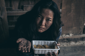 poor people,homeless or beggar begging for help sitting at dirty slum.concept for poverty...