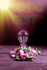 Text sign showing Blood Test. Business photo showcasing Extracted blood sample from an organism to...