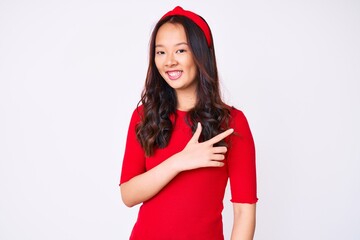 Young beautiful chinese girl wearing casual clothes smiling cheerful pointing with hand and finger up to the side