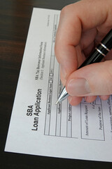 A Small Business Administration aka SBA loan application form, issued by the U.S.A. government, is shown up close in a vertical view.