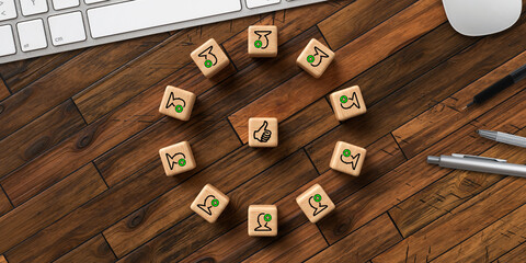 cubes in a circle with team icons and thumbs-up icon in the middle on wooden background