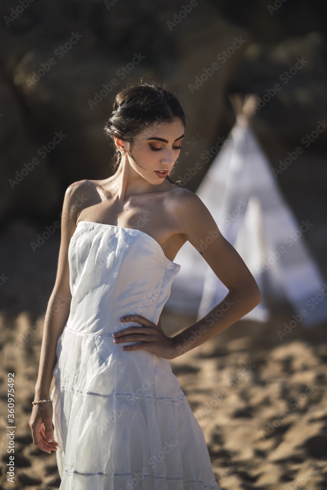 Sticker Brunette caucasian bride posing at the beach