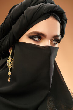 oriental girl with gold earring