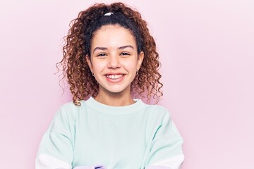 Beautiful kid girl with curly hair wearing casual clothes happy face smiling with crossed arms...