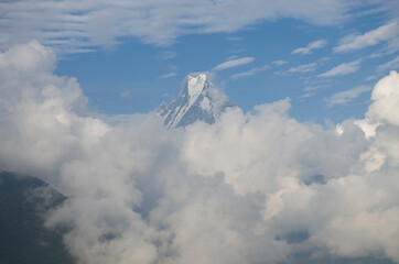 Naklejka na ściany i meble Top of Himalayan mountains in shroud 