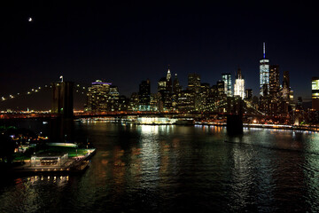 Fototapeta na wymiar New York, NY, U.S.A. - Night view of Brooklyn Bridge and Manhattan