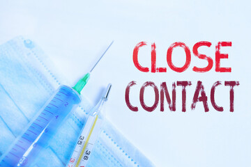 Writing note showing Close Contact. Business concept for having a history of direct exposure to a...