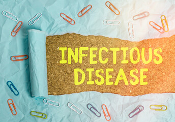 Conceptual hand writing showing Infectious Disease. Concept meaning caused by pathogenic...