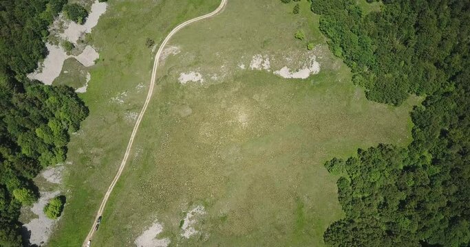 Aerial pan up, the Vercors massif rugged plateaux mountain in France