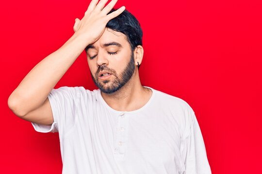 Young hispanic man wearing casual clothes surprised with hand on head for mistake, remember error. forgot, bad memory concept.