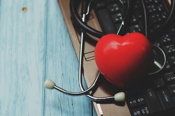 stethoscope and heart on computer