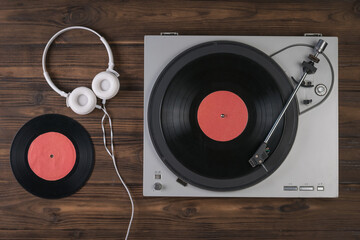Top view of a vinyl record player with headphones.
