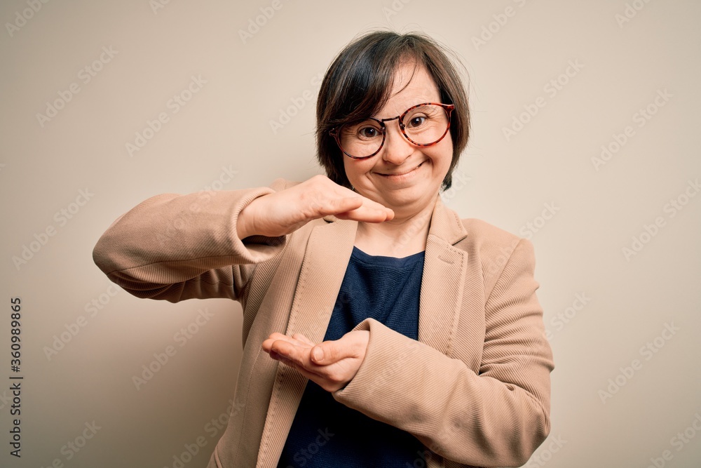 Sticker young down syndrome business woman wearing glasses standing over isolated background gesturing with 