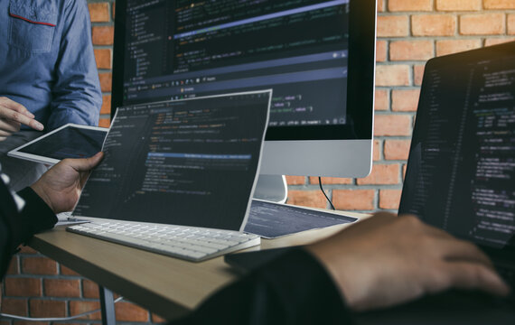Asian man working code program developer computer web development working design software on desk in office.