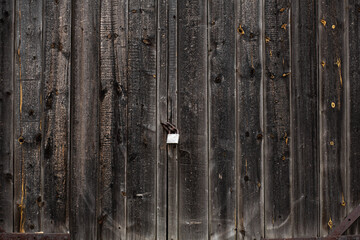 Close-up Large wooden gate and dried wood. Wood plank texture