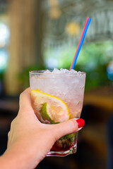 Refreshing mojito with crushed ice on a hot summer day