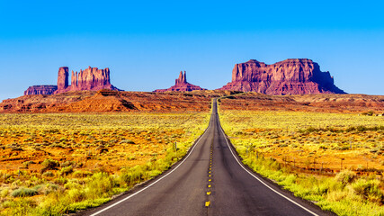 Highway 163 leading to the towering sandstone Buttes and Mesas of the Monument Valley Navajo Tribal Park in Utah-Arizona, United States. 'Forest Gump Point' where he stopped his cross country run