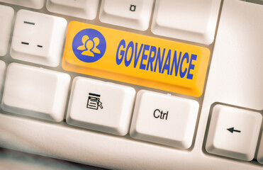 Conceptual hand writing showing Governance. Concept meaning exercised in handling an economic...