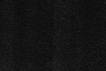 black concrete stone texture for background in black.  Cement and sand grey dark detail covering.