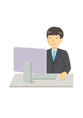 A man using a computer in a suit