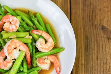 Asparagus Shrimp Seafood Cooked Health Food - Stir fried shrimps with asparagus green on white plate and wooden table background
