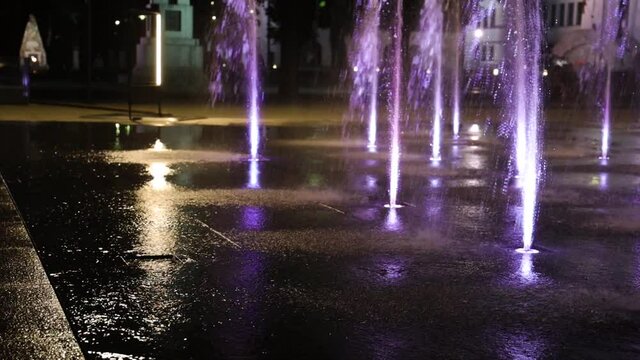 A pan though the dancing fountains in the park