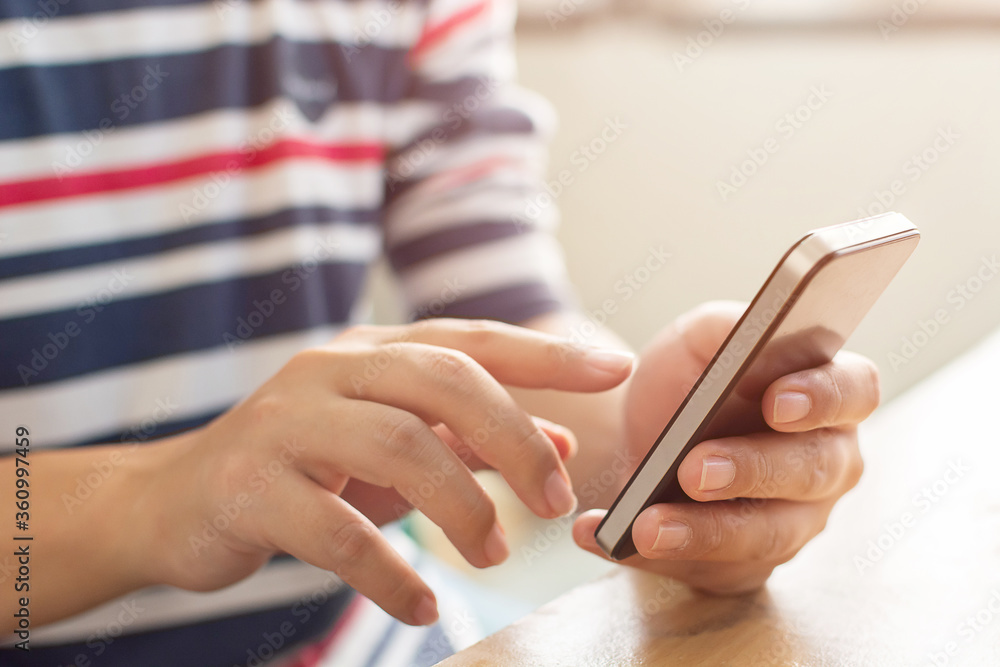 Poster close-up image of male hands using mobile smartphone, searching or typing message